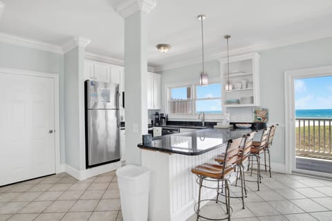The kitchen offers stainless appliances and granite counters