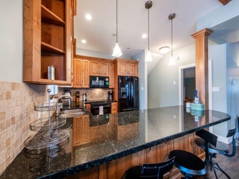 Large well stocked kitchen, with dining area adjacent.