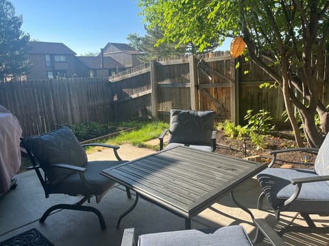 Back patio with patio furniture and BBQ