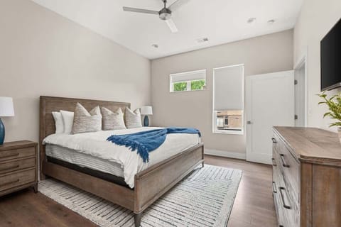 Guest bedroom w/ king bed with a beautiful window to look out to