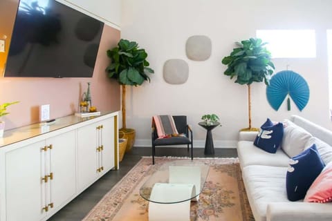 Gather with friends and family in the spacious living room, complete with a comfy couch and a Smart TV
