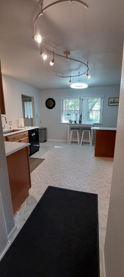 Full kitchen with dishwasher and ice maker.