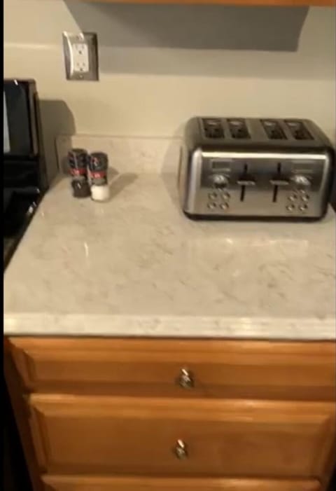 Gas stove and fully stocked kitchen.