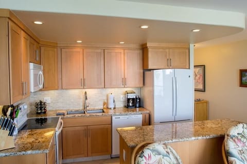Kitchen with maple cabinetry.