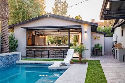 Pool, Waterfall, Backyard Bar, Ledge Lounger Chairs, Built in Grill