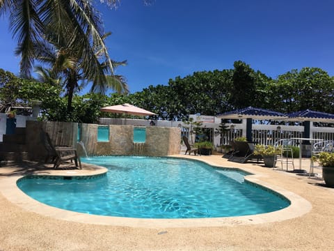 Pool with outdoor furniture. 