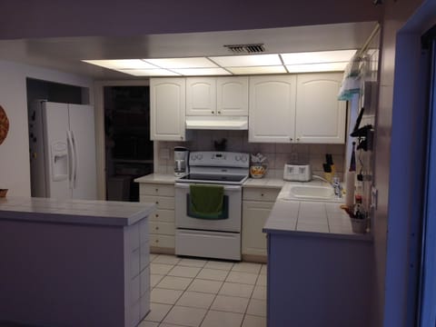 Kitchen with side-by-side fridge, oven, dishwasher and more 