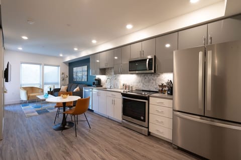 Spacious and efficient Kitchen featuring full-sized stainless steel appliances.