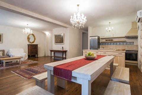 Fully-equipped kitchen and dining area in beachfront luxury villa on Brač with pool for vacation and rent.