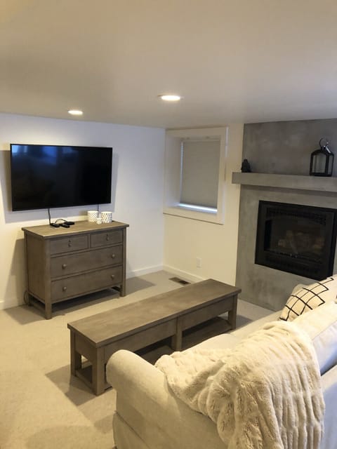 sitting area in downstairs bedroom with its own fireplace
