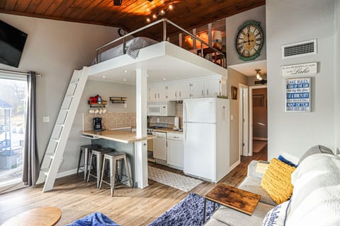 Queen bed loft above kitchen