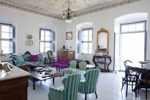 Upstairs Living room with hand painted ceiling on canvas, balcony & sea view