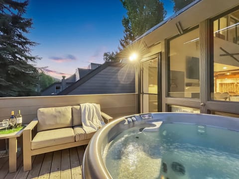 Welcome to Payday Piste Condo! The balcony features a 4-person hot tub to relax in.