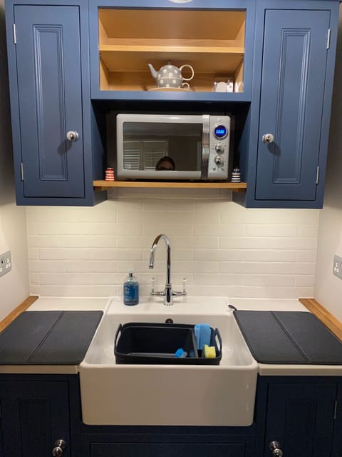 Kitchenette, plates bowls cutlery all provided as well as a microwave. 