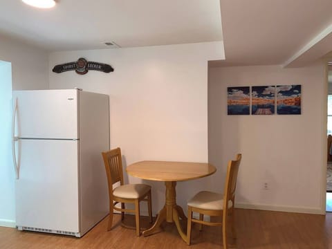 Fridge/freezer and breakfast nook in basement.