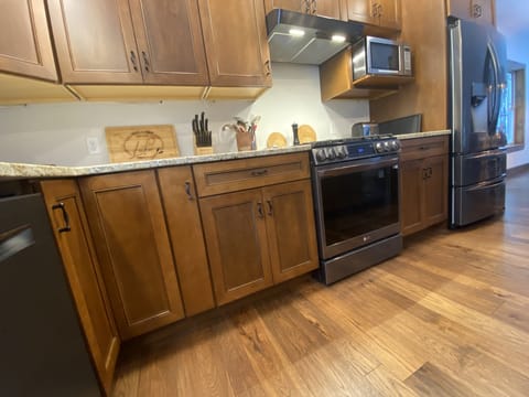 Counter view of stove/oven, microwave & refrigerator 