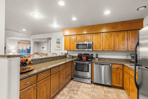 Snowflower 41 has a well-equipped kitchen with wooden cabinets and