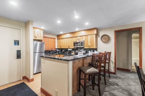 Snow Flower 007's kitchen has a breakfast bar with seating for 3.