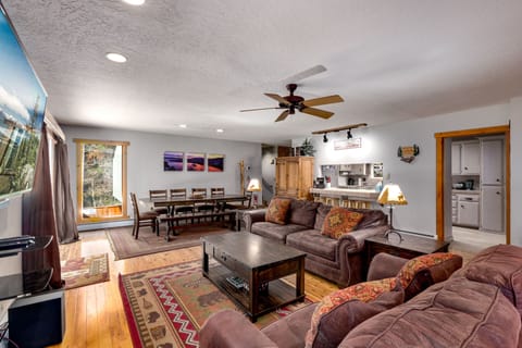 The main living room offers a warm and inviting atmosphere, perfect for group gatherings