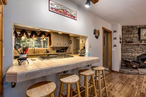 Pull up a stool at the charming wet bar—perfect for cocktails, conversation, and unwinding