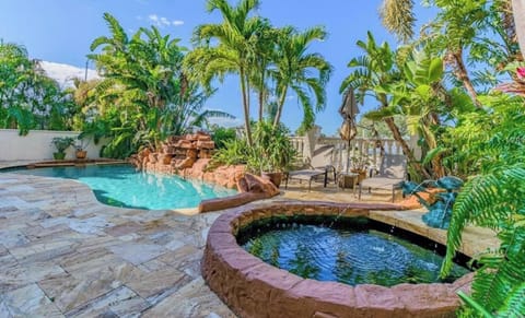 Private resort style pool with waterfall & koi pond
