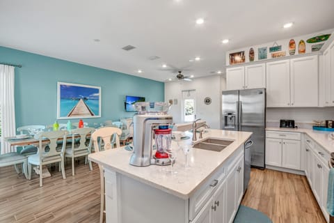 Where Culinary Magic Happens: Our Stylish Kitchen Seamlessly Blends into the Cozy Dining Area.