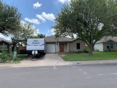 Front of the house and the RV that I stay in when I’m in town 