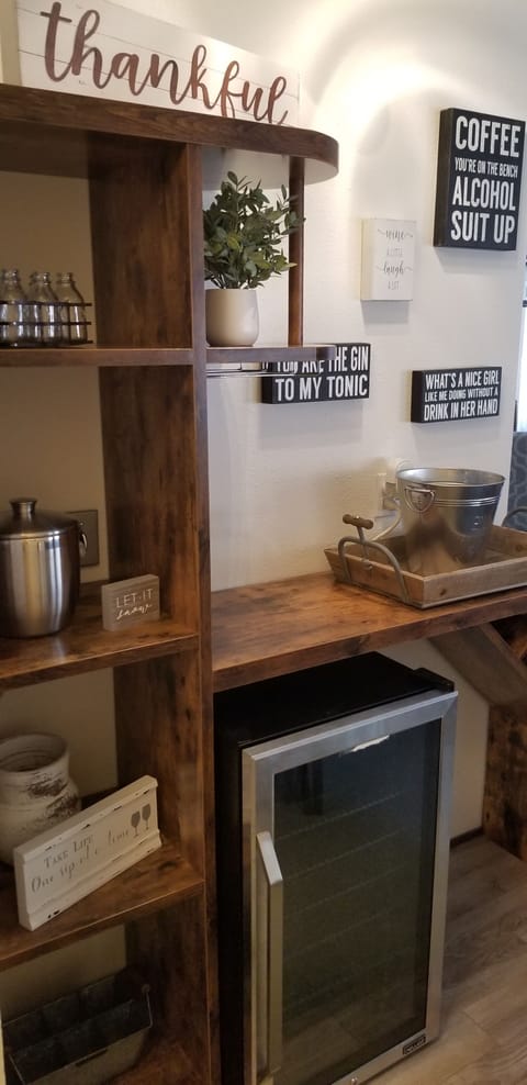 Make a drink at the bar, complete with beverage fridge & ice maker!