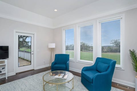 Sitting area with serene views in King master bedroom