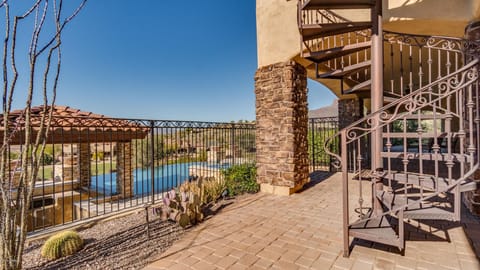 Lower level patio with spiral staircase
