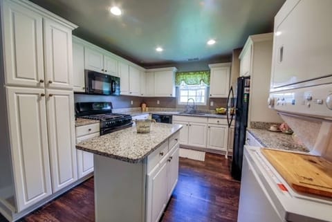 Everyone can gather around the kitchen island off the living room and be a part of the get together and enjoy.