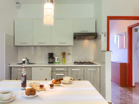 Food, Cabinetry, Property, Countertop, Tableware, Picture Frame, Kitchen, Wood, Kitchen Appliance, Orange