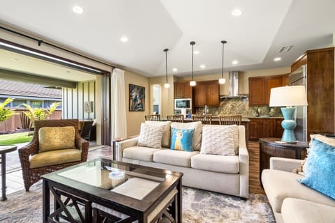 White couches highlight the living area.