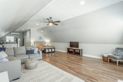 Open concept living room, kitchen, and bedroom.