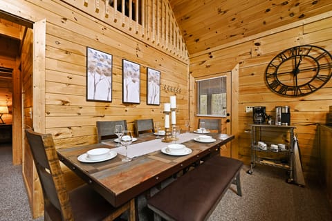 beyond the dining area is the door to the hot tub side of the deck