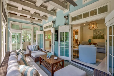 Back porch with french doors open to living area. Pool is to the rear of this