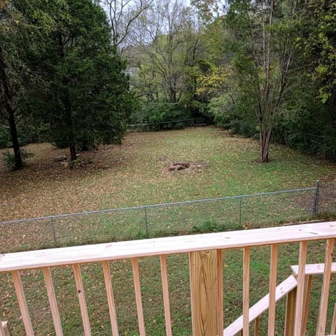 Fully Fenced Backyard just a short walk from deck stairs.