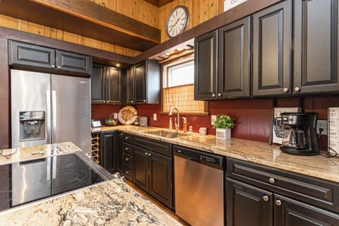 The remodeled kitchen boasts stainless steel appliances & new expresso cabinets!