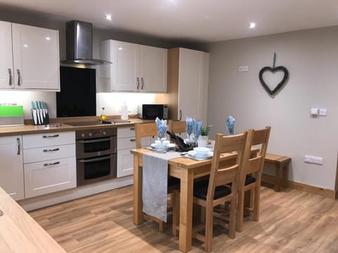 fully fitted kitchen with extendable table