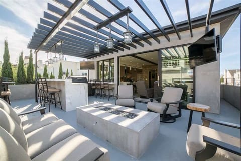 Upper deck, firepit, bar, and outdoor Tv