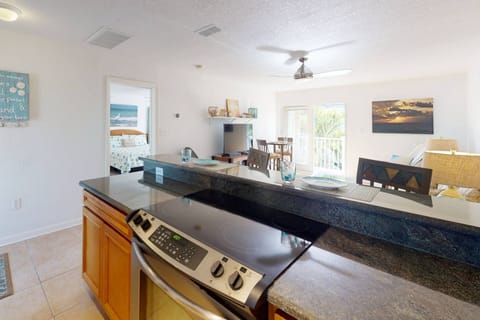Fully Equipped Kitchen with Stainless Appliances, Granite Counters, and Bar Seating