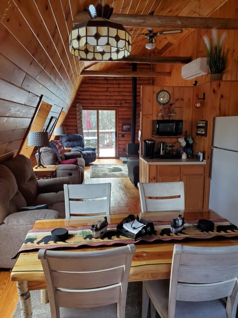 Kitchen has Keurig coffee pot, regular coffee pot and teapot