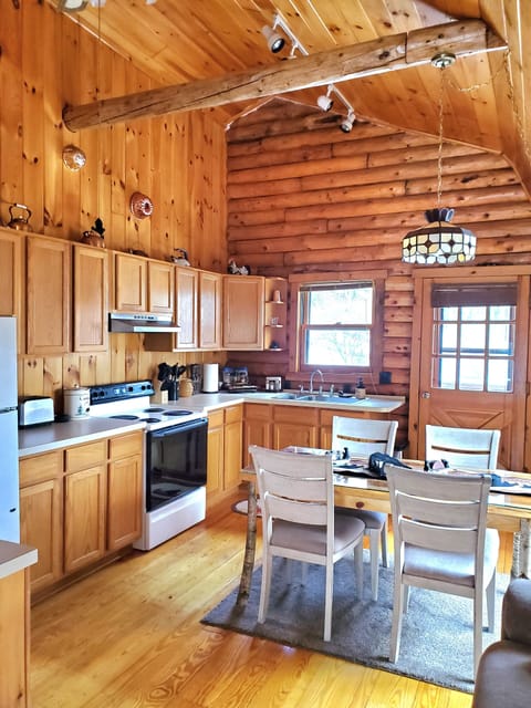 Kitchen has ample cabinets and amenities