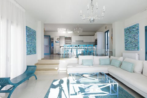 Sunny and airy open-plan living room allows you to host and entertain guests.