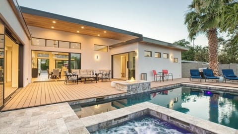 Pool, spa & deck with glass doors for seamless indoor-outdoor living.