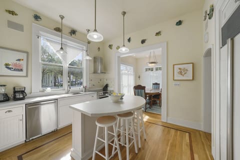 ADJACENT KITCHEN WITH BAR TOP SEATING FOR THREE
