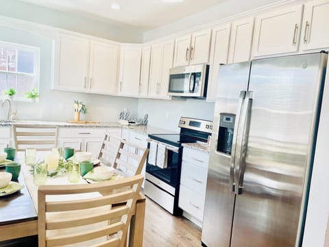 Fully equipped kitchen with LG full fridge with ice maker, stove, oven, micro.