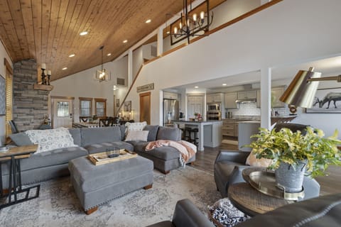 Living Area With Plush Sofas And Grand Timber Beams