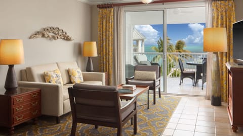 Spacious living room with furnished balcony.