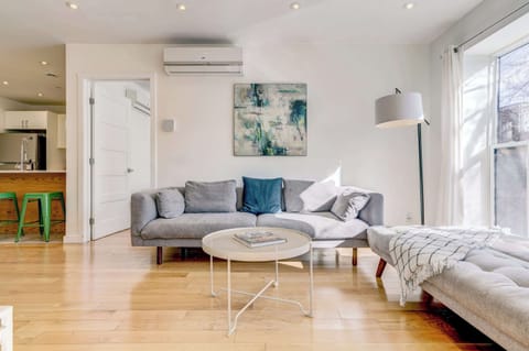 Light-filled living area with a cozy sectional sofa and daybed.